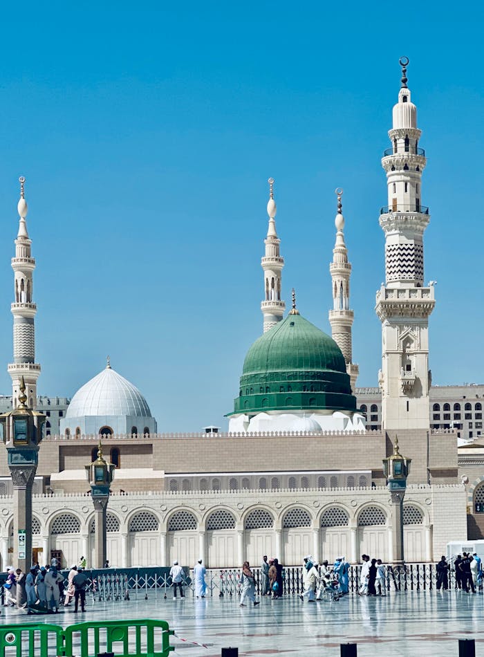 A beautiful view of Al-Masjid an-Nabawi with its iconic green dome in Madinah, Saudi Arabia.